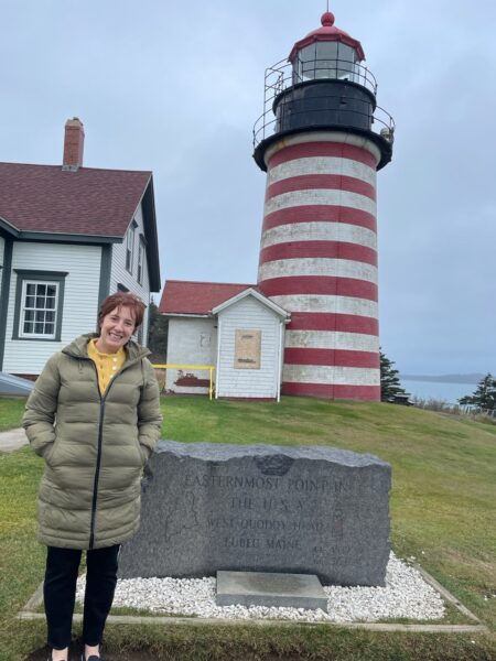 Author Casey Robinson in Maine at Quoddy Head Light